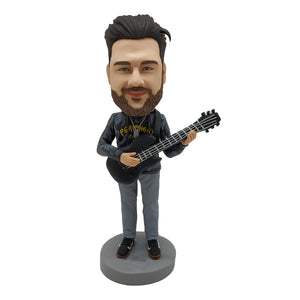 Lalka Bobblehead dla miłośników muzyki z gitarą