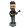 Lalka Bobblehead dla miłośników muzyki z gitarą